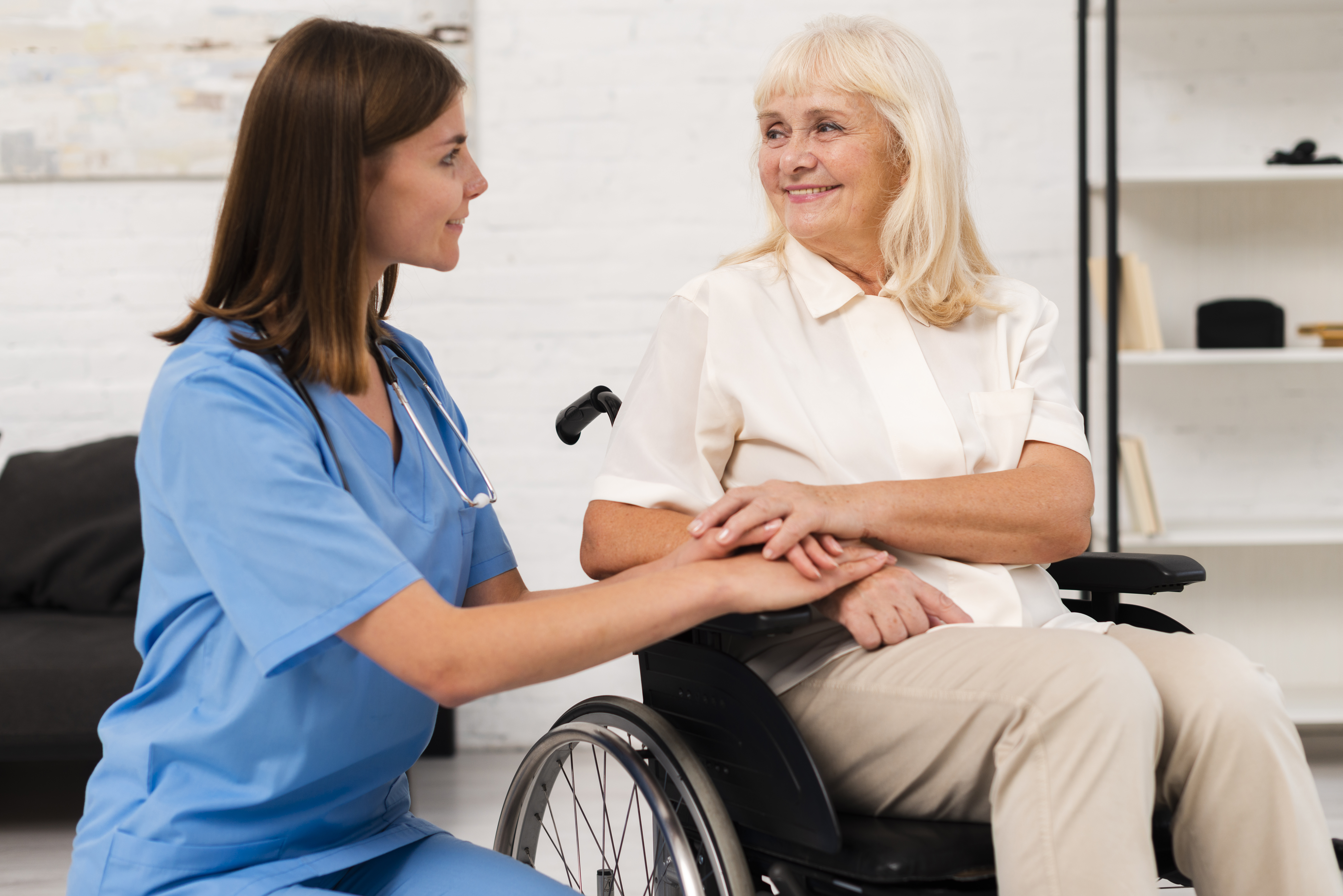 caregiver taking care woman wheelchair